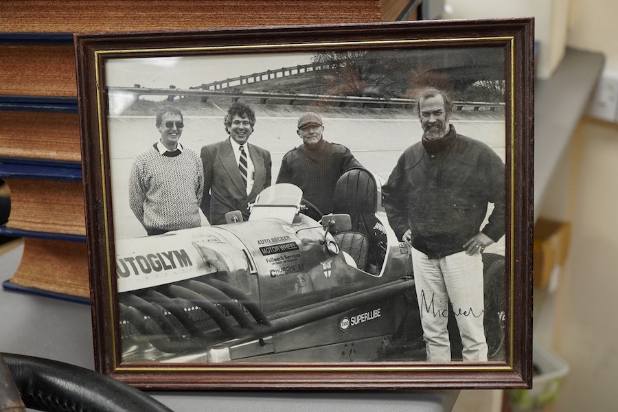 Racing ephemera, including; a Moto-lite steering wheel, a driver's leather cap, an enamelled Le Mans pilot’s radiator badge, signed photograph of Prince Michael Kent standing next to a 12 cylinder single seat racing car